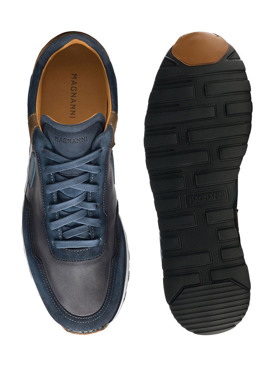 A pair of blue Magnanni Aero in Navy/Taupe sneakers from the retro runner collection, one showing the top view and the other showing the sole.