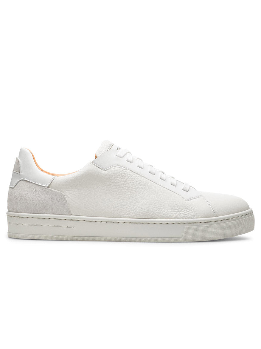 The Magnanni Amadeo in White is a luxury sneaker expertly made in Spain, featuring white leather with a flat sole, lace-up design, and subtle stitching details.