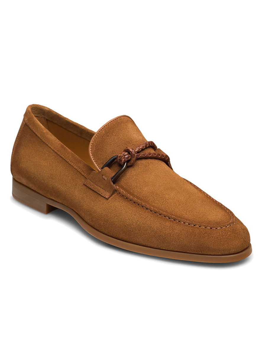 The Magnanni Destin in Segale Suede is a contemporary loafer made in Spain, crafted from tan suede with a low heel and finished with a braided leather strap across the upper.