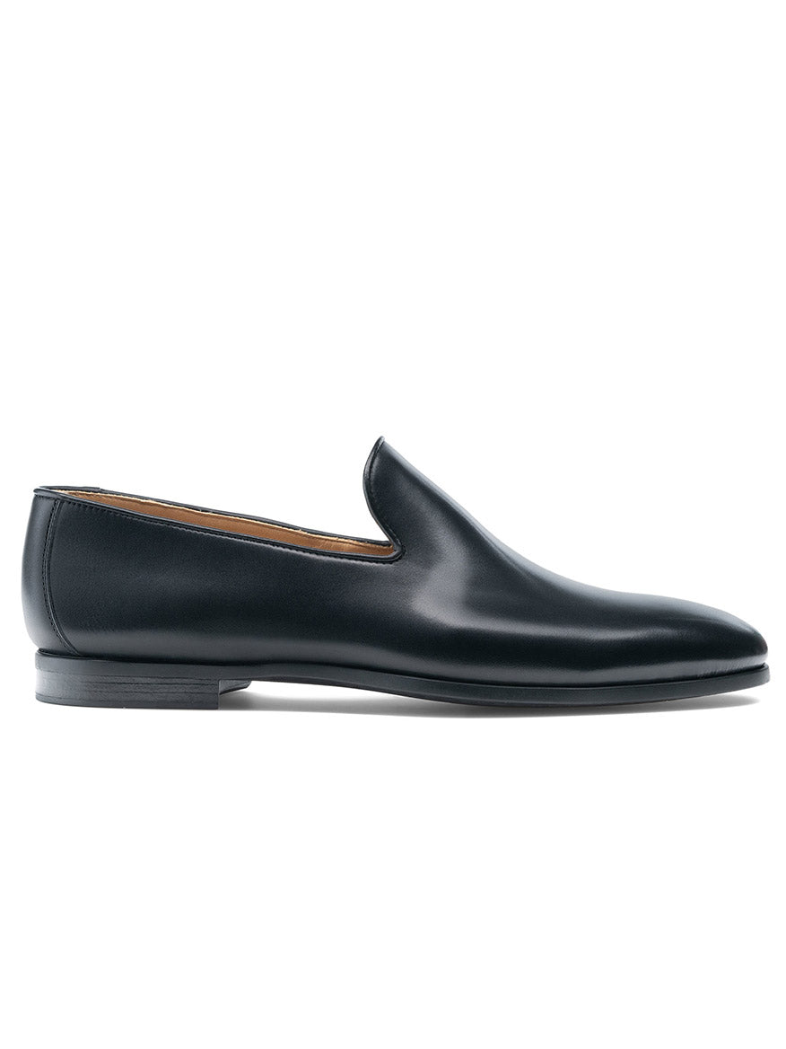 The Magnanni Diaz in Black is a black calfskin leather venetian loafer with a low heel and rounded toe, shown from the side on a white background.