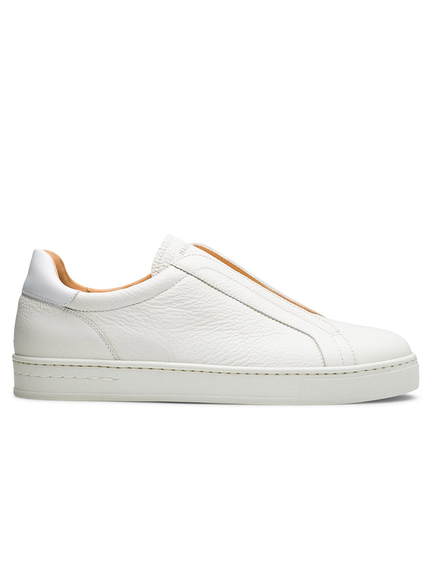 A side view of the Magnanni Gasol slip-on sneaker in Tumbled White showcases a textured leather surface, smooth Artesano sole, and elastic gore system for easy wear.