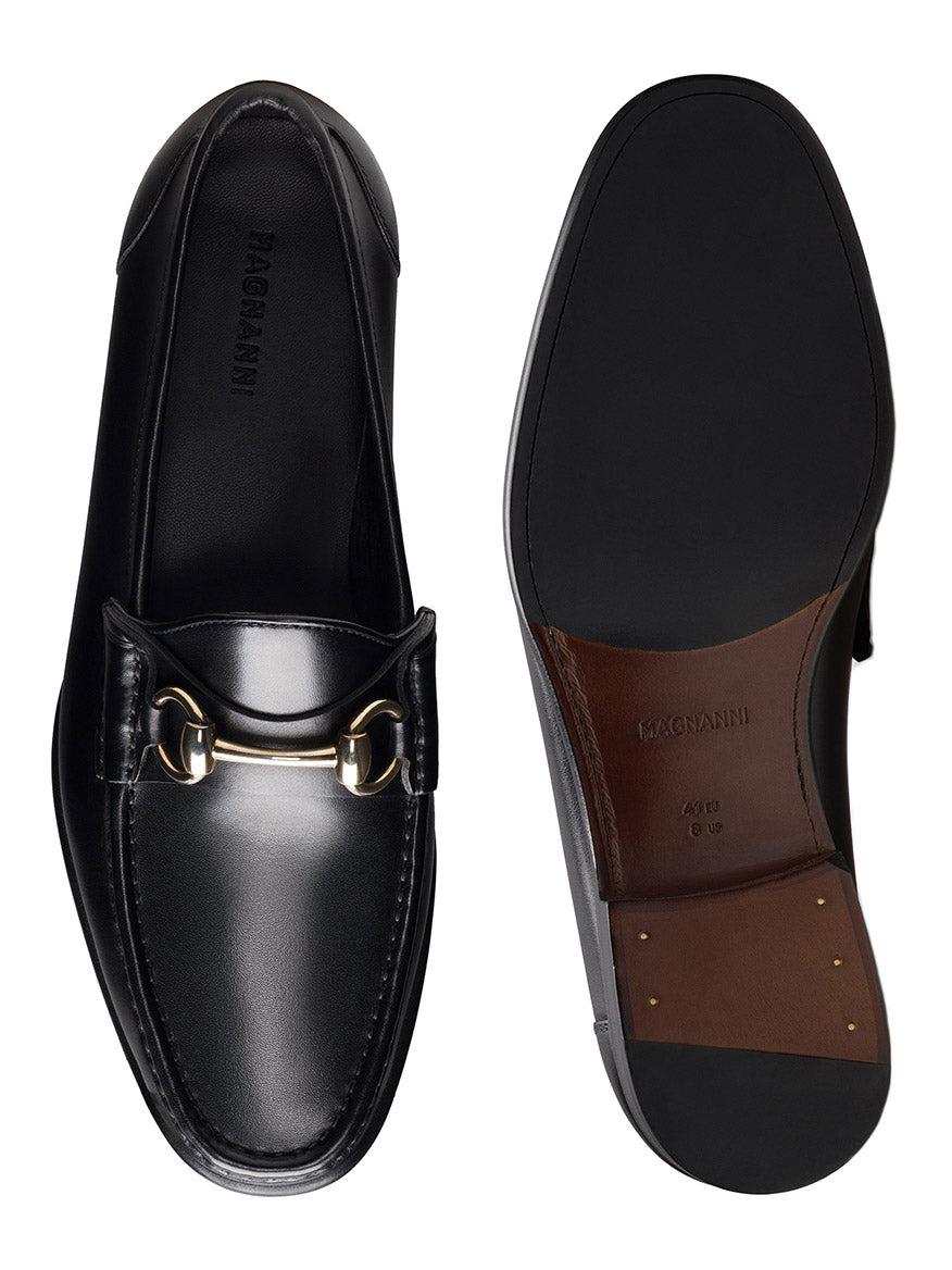 The Magnanni Giancarlo in Black features leather moccasin loafers with a polished bit ornament, shown from top and bottom views to highlight the sole and branded insole.