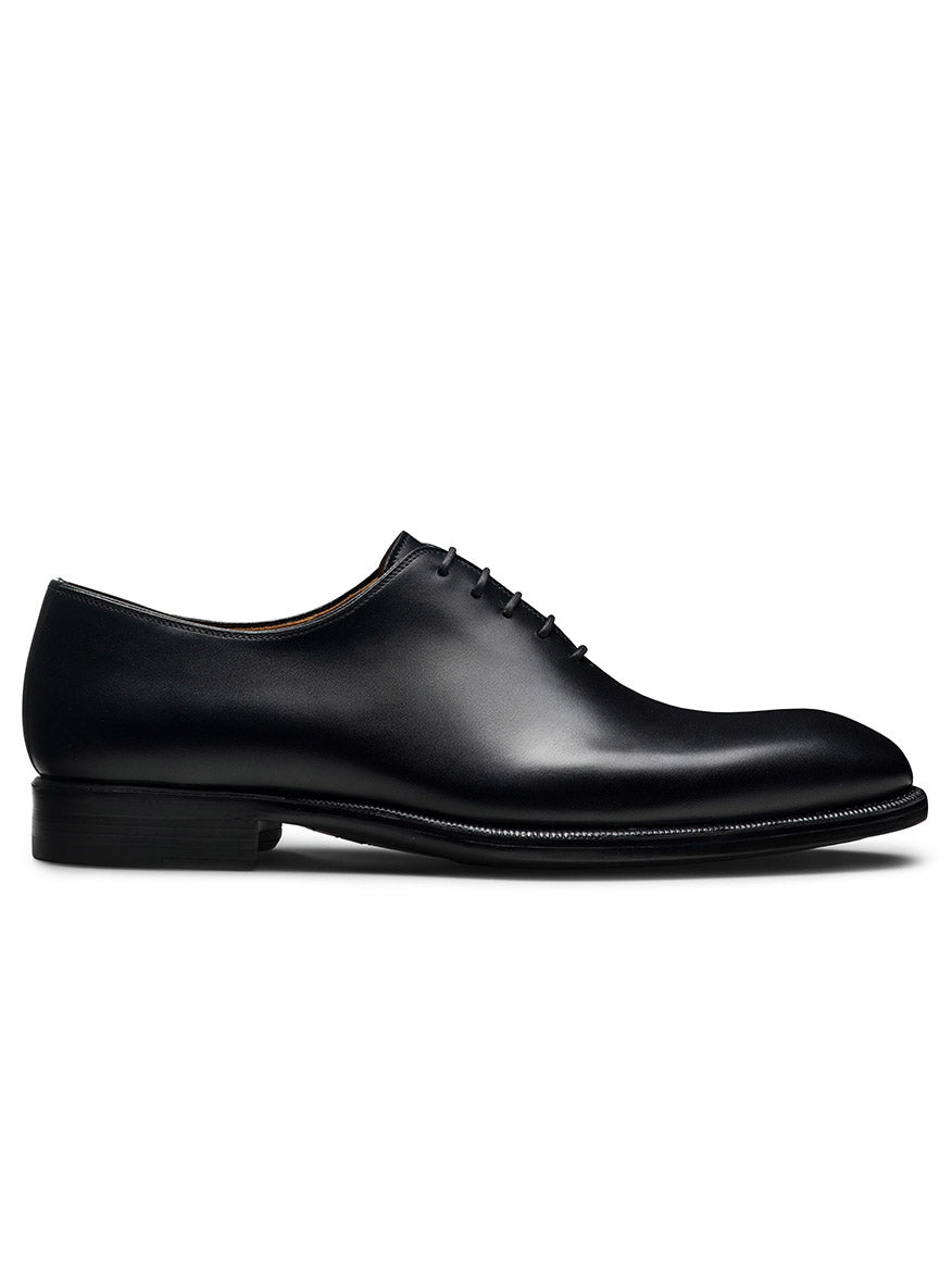 The Magnanni Hawkins in Black is a sleek formal leather oxford shoe crafted with Bologna construction and featuring black laces, all showcased on a white background.