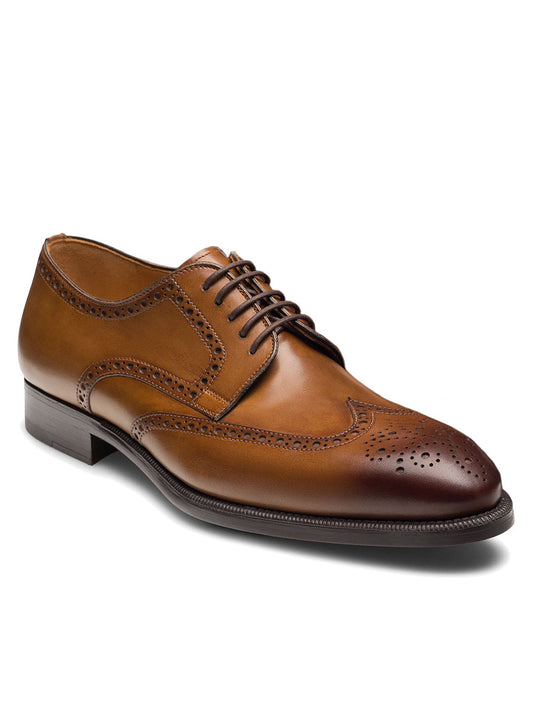 Magnanni Heyward in Tabaco—a brown leather brogue wingtip derby with classic oxford styling, laces, and a low heel—displayed on a plain white background.