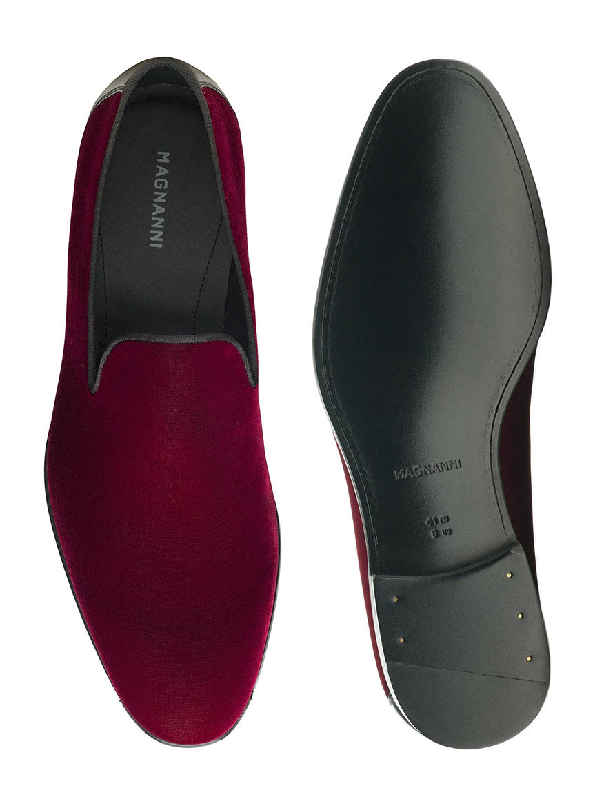 Two Magnanni Jareth in Burgundy Velvet slipper loafers displayed from above, one showcasing its deep red upper and the other its black sole with size marking "42.