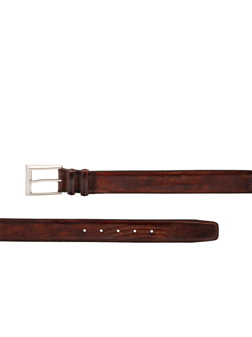 The Magnanni Lizard Belt in Cognac is shown from the front and side, featuring a silver rectangular buckle and multiple holes for adjustable sizing.