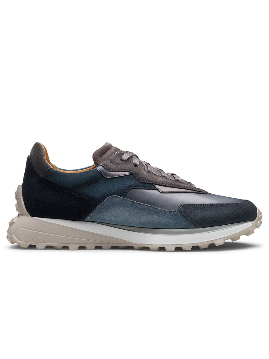 The Magnanni Onyx in Navy/Grey is a sleek, modern sneaker featuring shades of black, grey, and blue with an Onyx sports sole for enhanced grip.