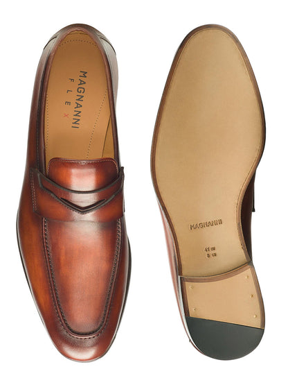 A pair of Magnanni Sasso in Cognac penny loafers with Bologna construction.