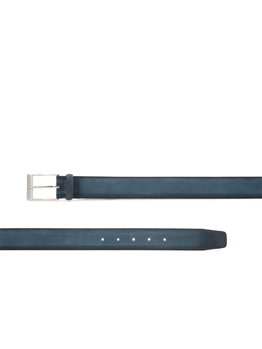 The Magnanni Telante Belt in Indigo Suede features a sleek silver rectangular buckle and multiple adjustment holes—a stylish choice to elevate any man's wardrobe.
