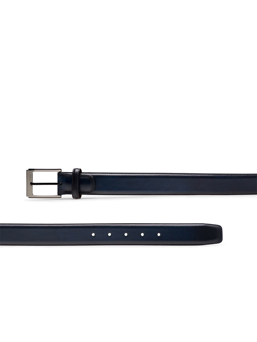 The Magnanni Vega Belt in Navy is a luxury men's belt crafted from navy blue calfskin leather with a silver rectangular buckle, displayed from both the buckle end and the tip with adjustment holes.