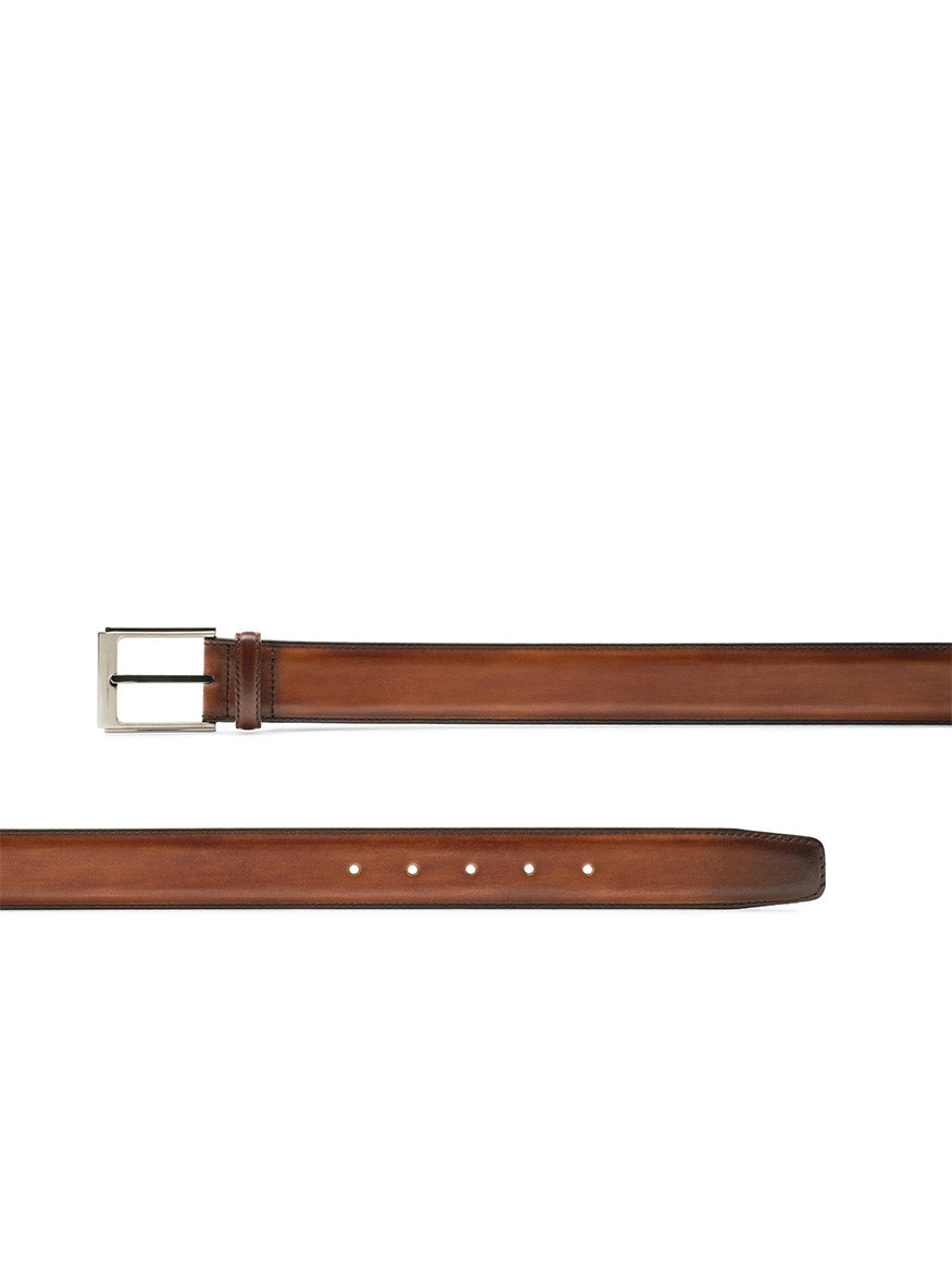 Brown Magnanni Vega Belt in Cognac calfskin belt with polished nickel buckle, shown unbuckled and lying flat against a white background.