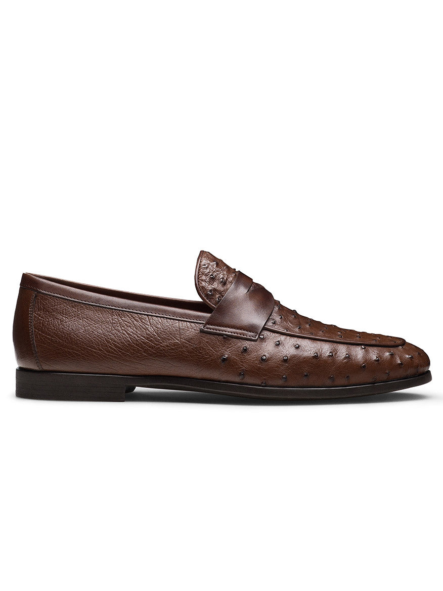 The Magnanni Viggo in Tabaco features brown ostrich leather with a textured upper and flat black sole. Shown in side profile, these handcrafted men’s shoes deliver timeless penny loafer style.