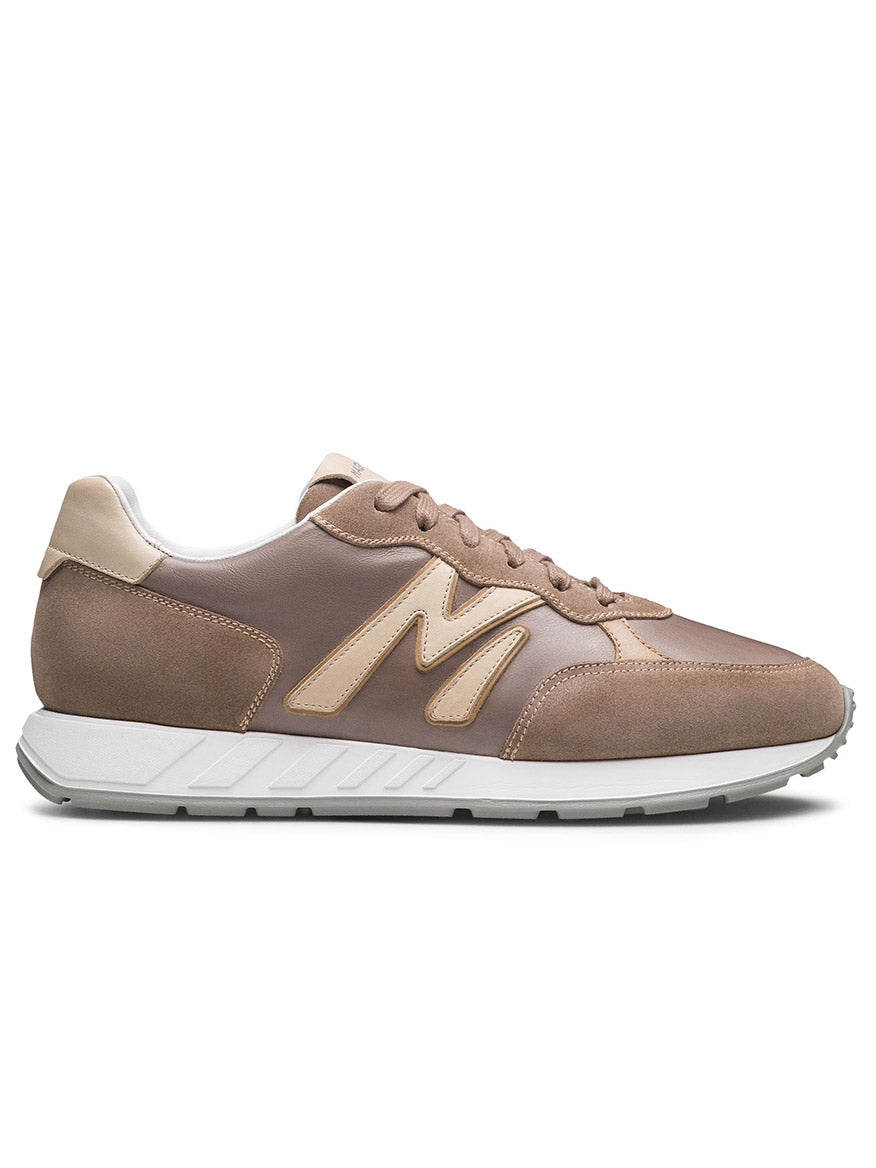 The Magnanni Yoki in Torba/Cream is a retro sneaker with a prominent "M" logo, athletic style sole, supple leathers, and features a white sole with matching laces, set against a plain white background.