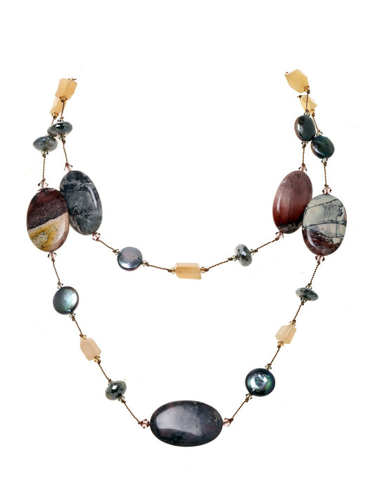 A Margo Morrison Mystic Labradorite, Peach Moonstone, and Jasper Necklace with various polished labradorite, moonstone, and beads on a white background.