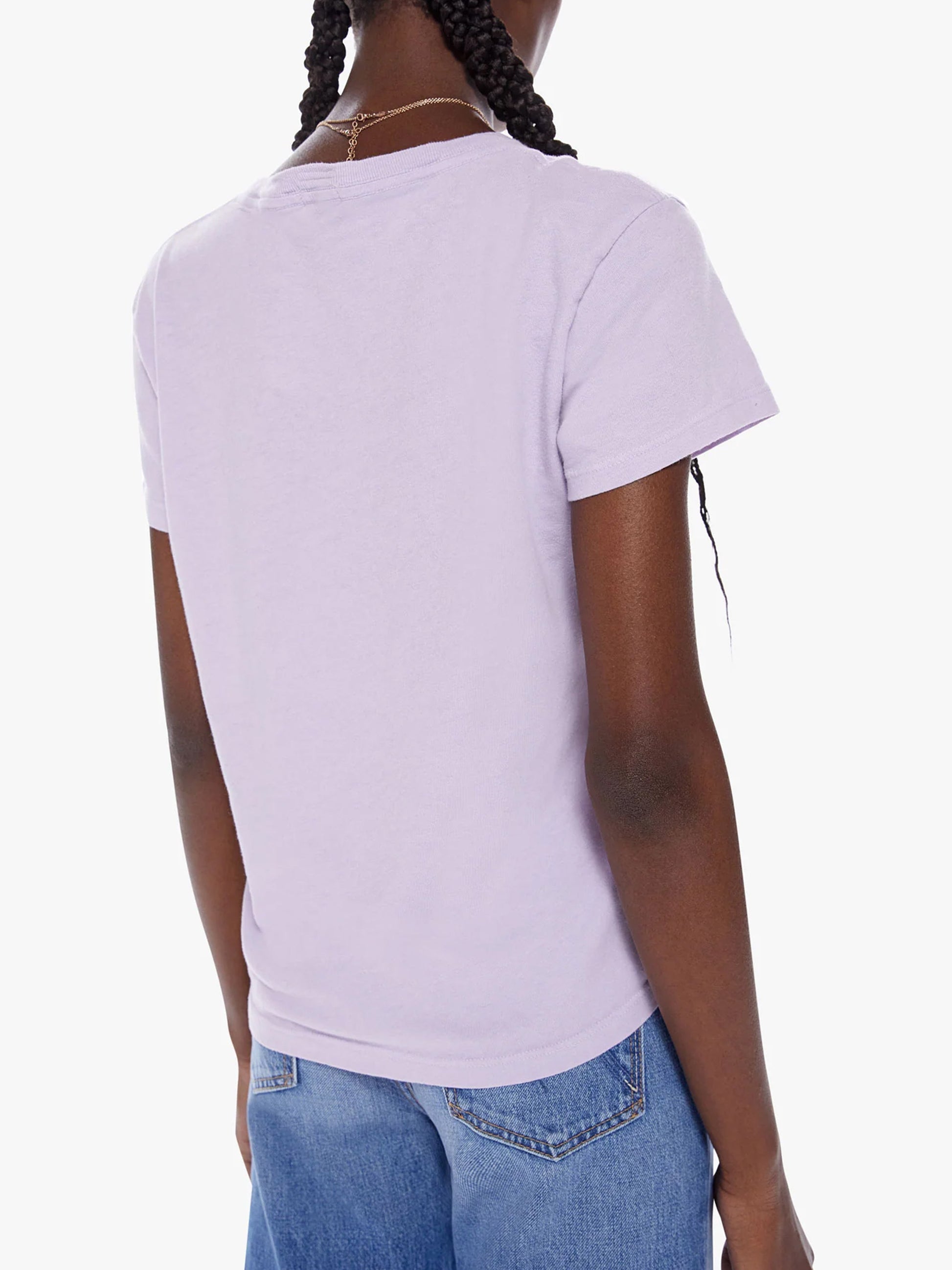 Rear view of a woman wearing a plain lavender crewneck tee and Mother Denim The Boxy Goodie Goodie in Daisies Don't Tell, standing against a white background.