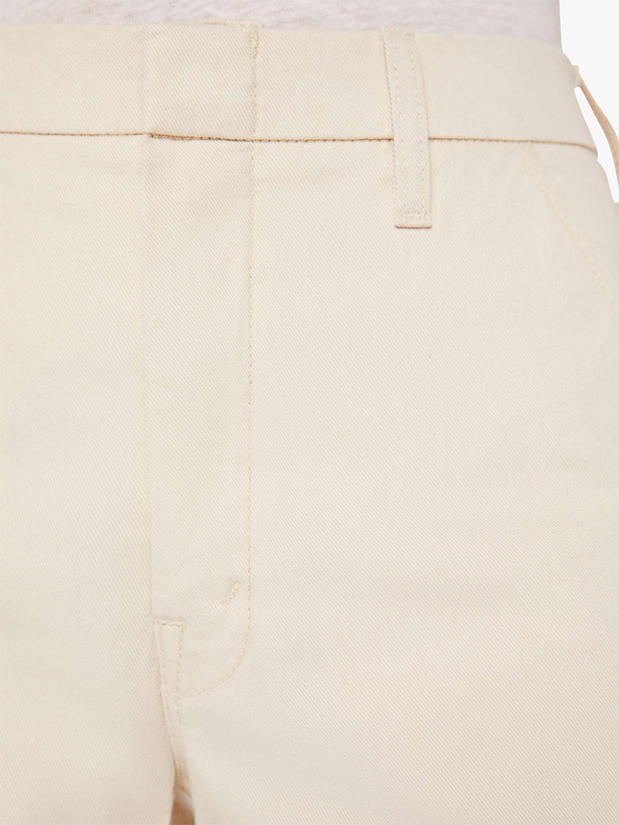 Close-up of a Mother Denim The Sk8er Prep Sneak Trouser in Ecru focusing on a pocket detail.