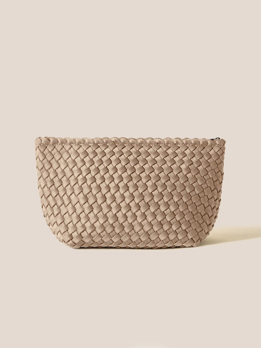 Naghedi Portofino Cosmetic Clutch in Solid Cashmere on a plain light background, showcasing its intricate texture and oval shape, perfect for easy organization of little essentials.