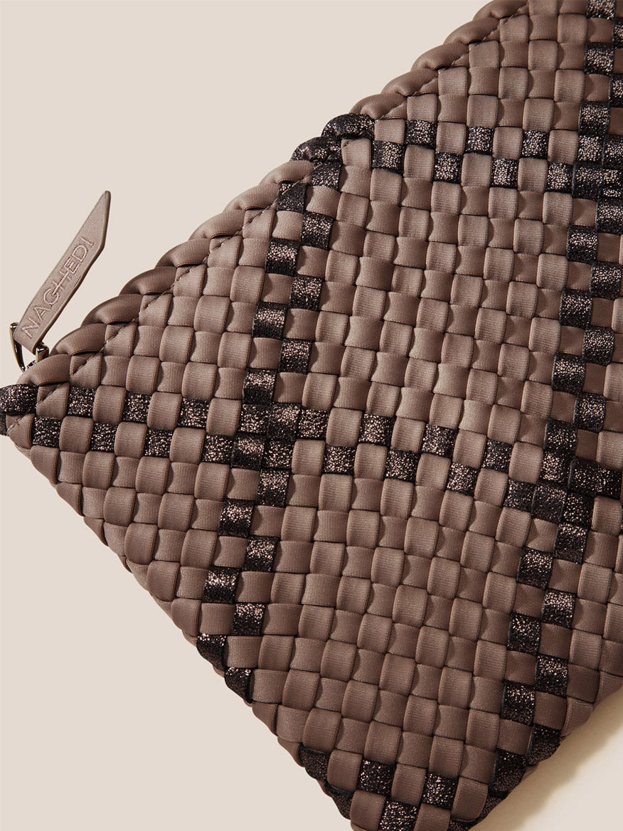 Close-up of a textured Naghedi St. Barths Medium Tote in Plaid Mojave with handwoven detailing and a visible brand tag.