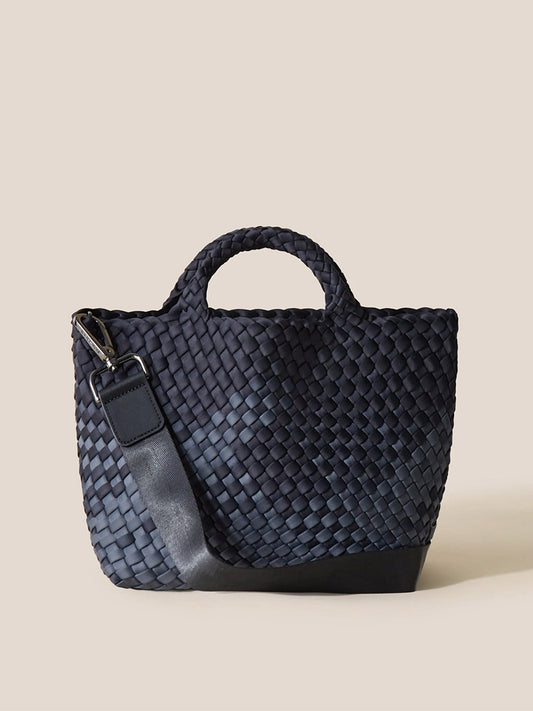 A Naghedi St. Barths Small Tote in Graphic Ombre Basalt handwoven neoprene tote bag with a sturdy handle and a detachable shoulder strap, displayed against a neutral beige background.