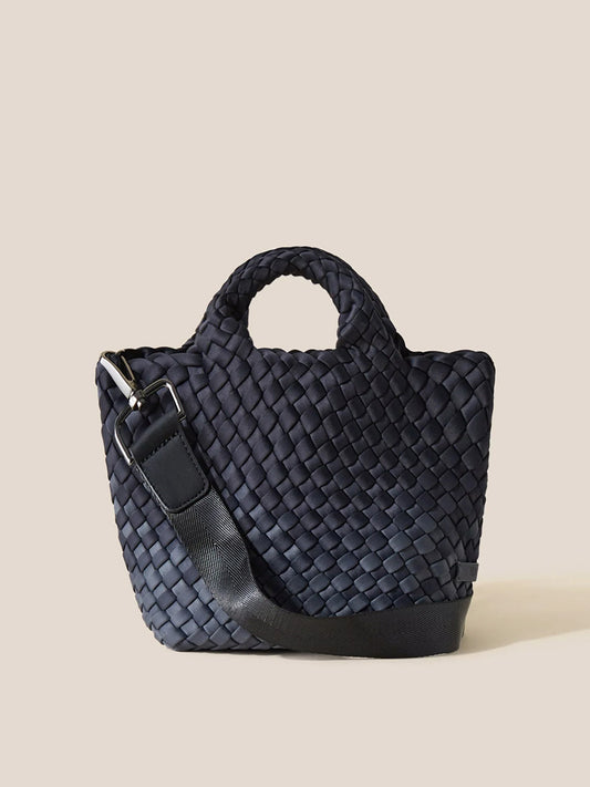 A Naghedi St. Barths Petit Tote in Graphic Ombre Basalt with handles and a shoulder strap, displayed against a neutral background.
