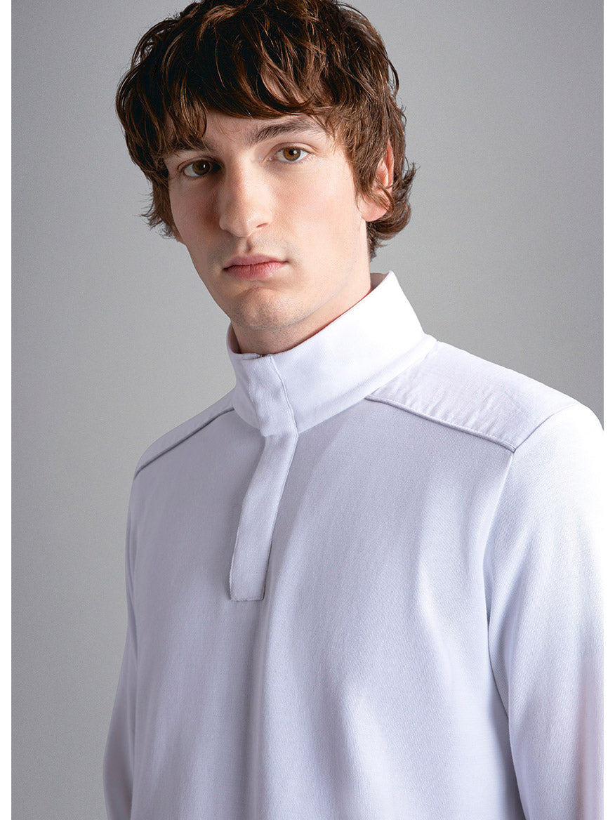 Young man with curly hair in a Paul & Shark Fresco Cotton Sweater With Linen Details in White, featuring a ribbed collar, against a neutral background.