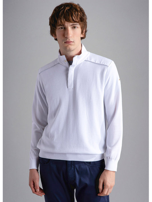 Man modeling a white long-sleeve Paul & Shark Fresco Cotton Sweater With Linen Details polo shirt with a ribbed collar and navy trousers.
