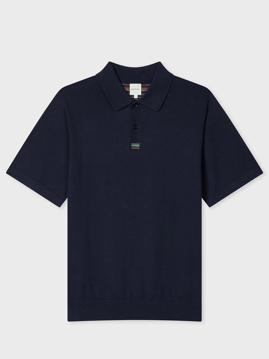 The Paul Smith Knitted Cotton 'Signature Stripe' Trim Polo Shirt in Navy is crafted from soft organic cotton, with a collar, button placket, and subtle Signature Stripe trim on the placket.