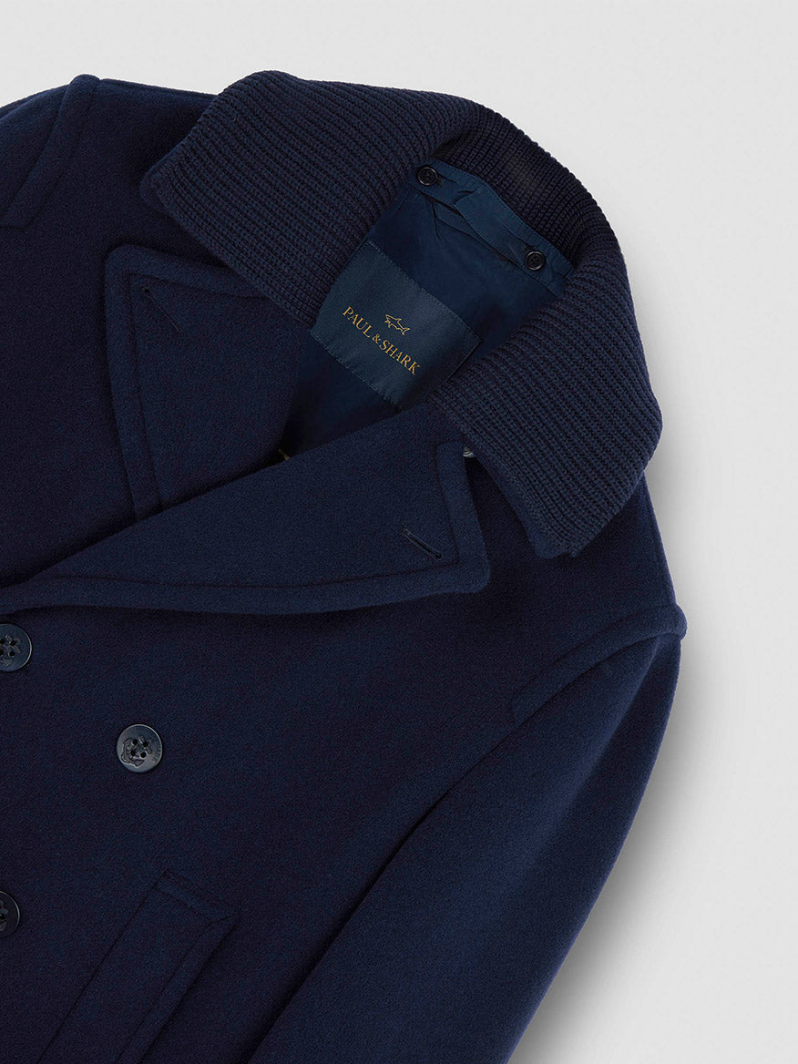 The Paul & Shark Peacoat in Wool & Cashmere in Navy features a ribbed collar, double-breasted closure, and visible brand label inside.