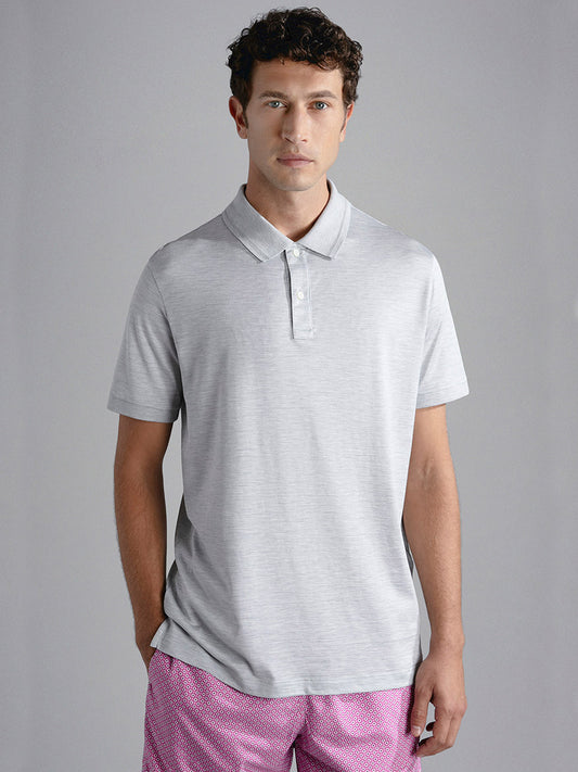 Man wearing a Paul & Shark Cotton & Silk Polo in Medium Grey and patterned shorts standing against a neutral background.