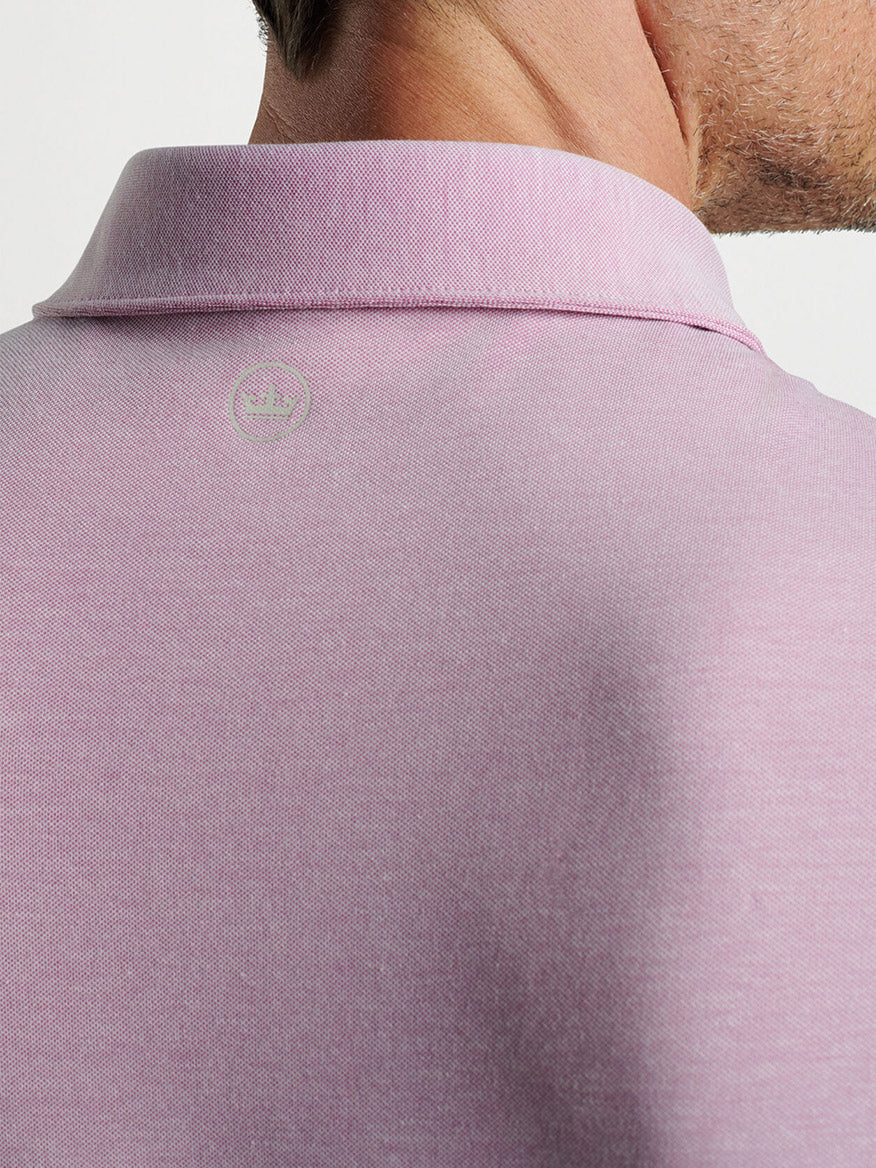 Close-up of a Peter Millar Albatross Cotton Blend Piqué Polo in Valencia shirt collar with embroidered albatross logo.