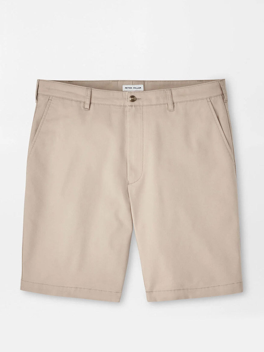 The Peter Millar Crown Comfort Short in Khaki features a classic fit, knee-length cut with belt loops, front pockets, and a button closure. Crafted from plain weave fabric and shown laid flat on a white background.