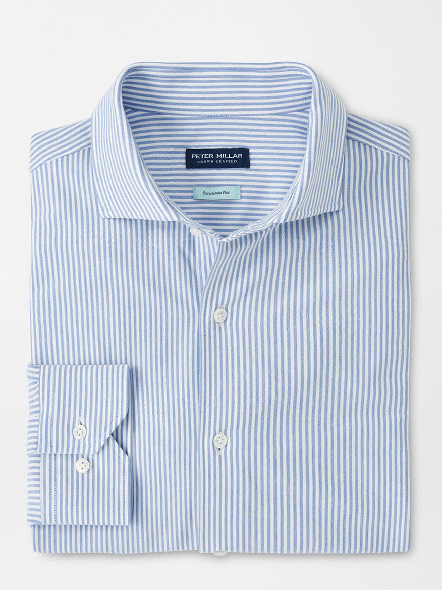 The Peter Millar Excursionist Flex Stripe Sport Shirt in Rain Cloud features blue and white vertical stripes, a front pocket, classic collar, and comfortable cotton-stretch fabric.