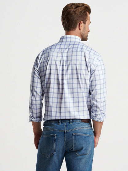 Man standing with his back to the camera wearing a Peter Millar Gorham Crown Lite Cotton-Stretch Sport Shirt in White and denim jeans.