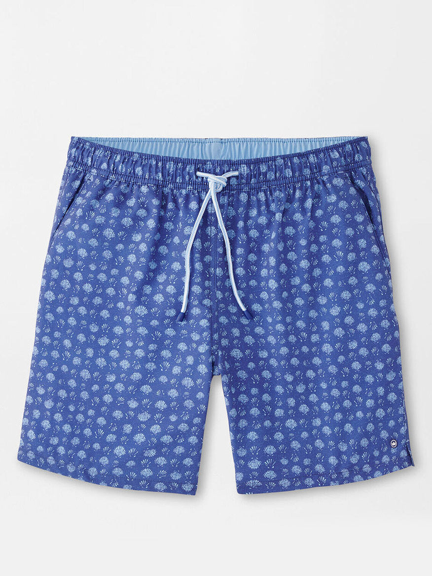 The Peter Millar Hatteras Harvest Swim Trunk in Ocean Blue features a chic seashell print, a drawstring waistband, and a right-side buttoned pocket. The light blue lining offers comfort and style with four-way stretch for ease of movement.