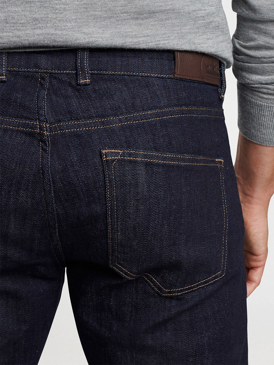 Close-up of Peter Millar Vintage Washed Five-Pocket Denim in Dark Indigo back pocket detailing.