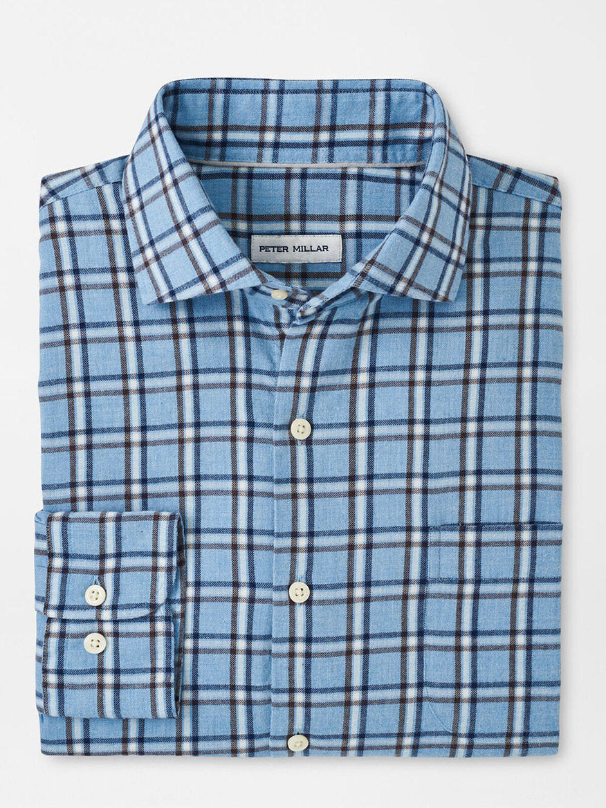 The Peter Millar Nelson Flannelite Cotton-Stretch Sport Shirt in Cottage Blue is a folded plaid button-up with white buttons, offering a lightweight design for comfort and effortless style against a white background.