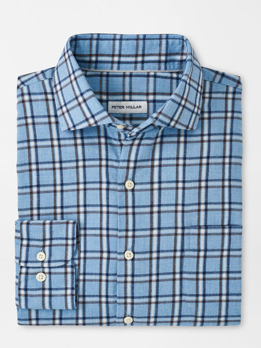 The Peter Millar Nelson Flannelite Cotton-Stretch Sport Shirt in Cottage Blue is a folded plaid button-up with white buttons, offering a lightweight design for comfort and effortless style against a white background.