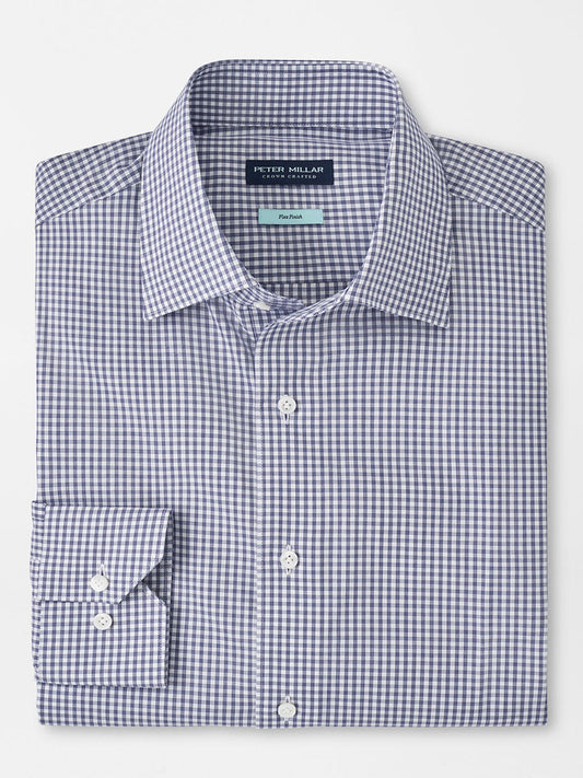 Folded Peter Millar Renato Cotton Sport Shirt in Atlantic Blue with a gingham pattern and button-down collar, displayed on a flat surface.