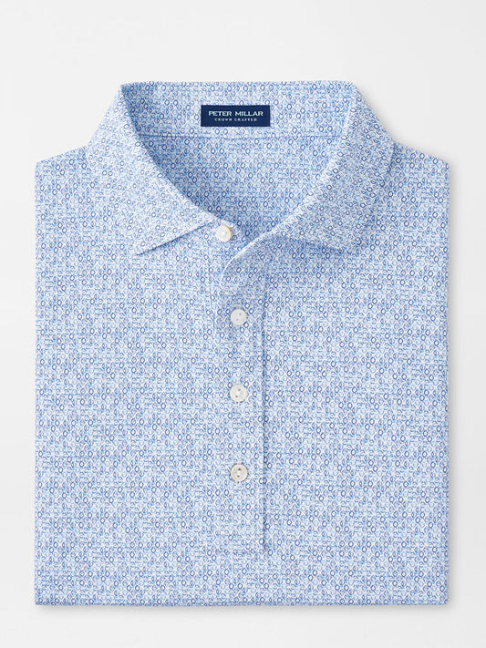 Folded Peter Millar Rhythm Performance Jersey Polo in White/Blue Pearl with UPF 50+ sun protection, collar, and buttons displayed on a plain background.