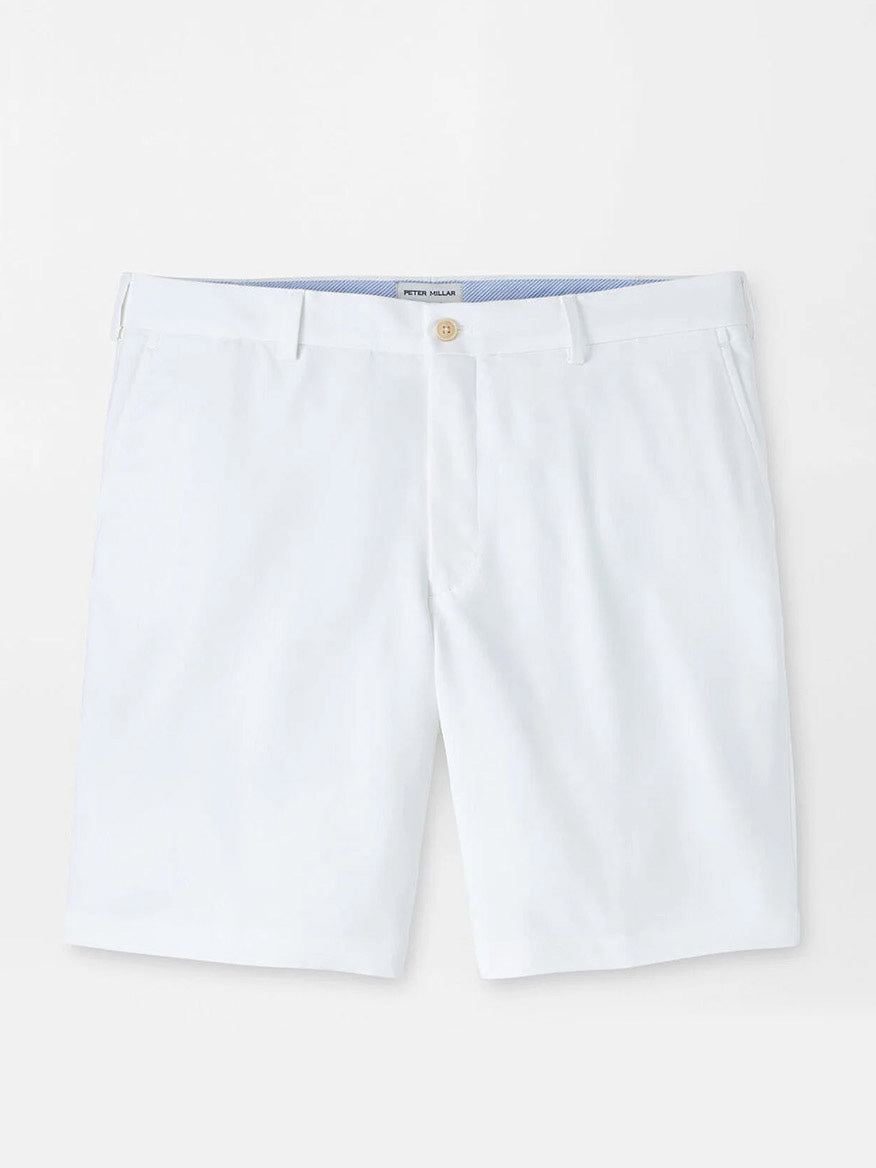 The Peter Millar Salem Performance Short in White is a classic-fit, knee-length short made from lightweight stretch twill with belt loops, side pockets, and a button closure, shown against a plain background.