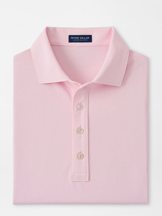 Folded Peter Millar Soul Performance Mesh Polo in Misty Rose with collar and button placket displayed on a plain background.