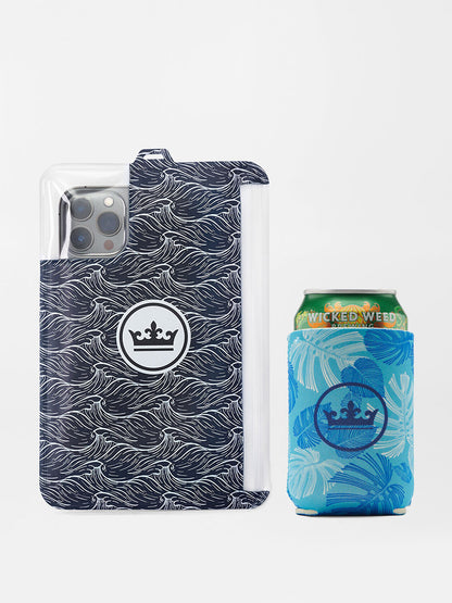 A Peter Millar Tropicrazy Swim Trunk in Atlantic Blue with a decorated beverage can next to it.
