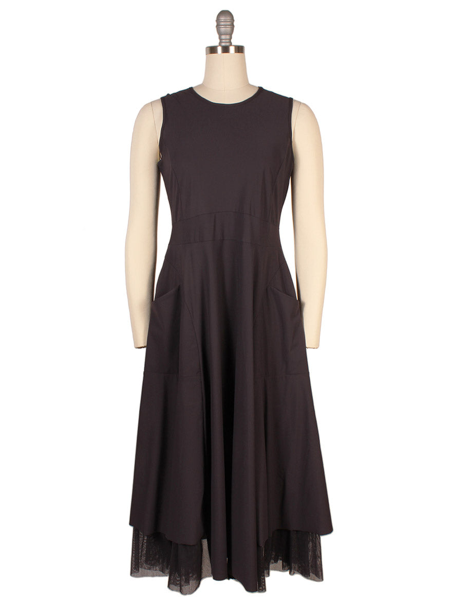 The Porto Lydia Dress in Mulberry, made in Italy, features a fitted bodice, flared skirt with mesh ruffle hem detail, two front pockets, and is shown on a mannequin.