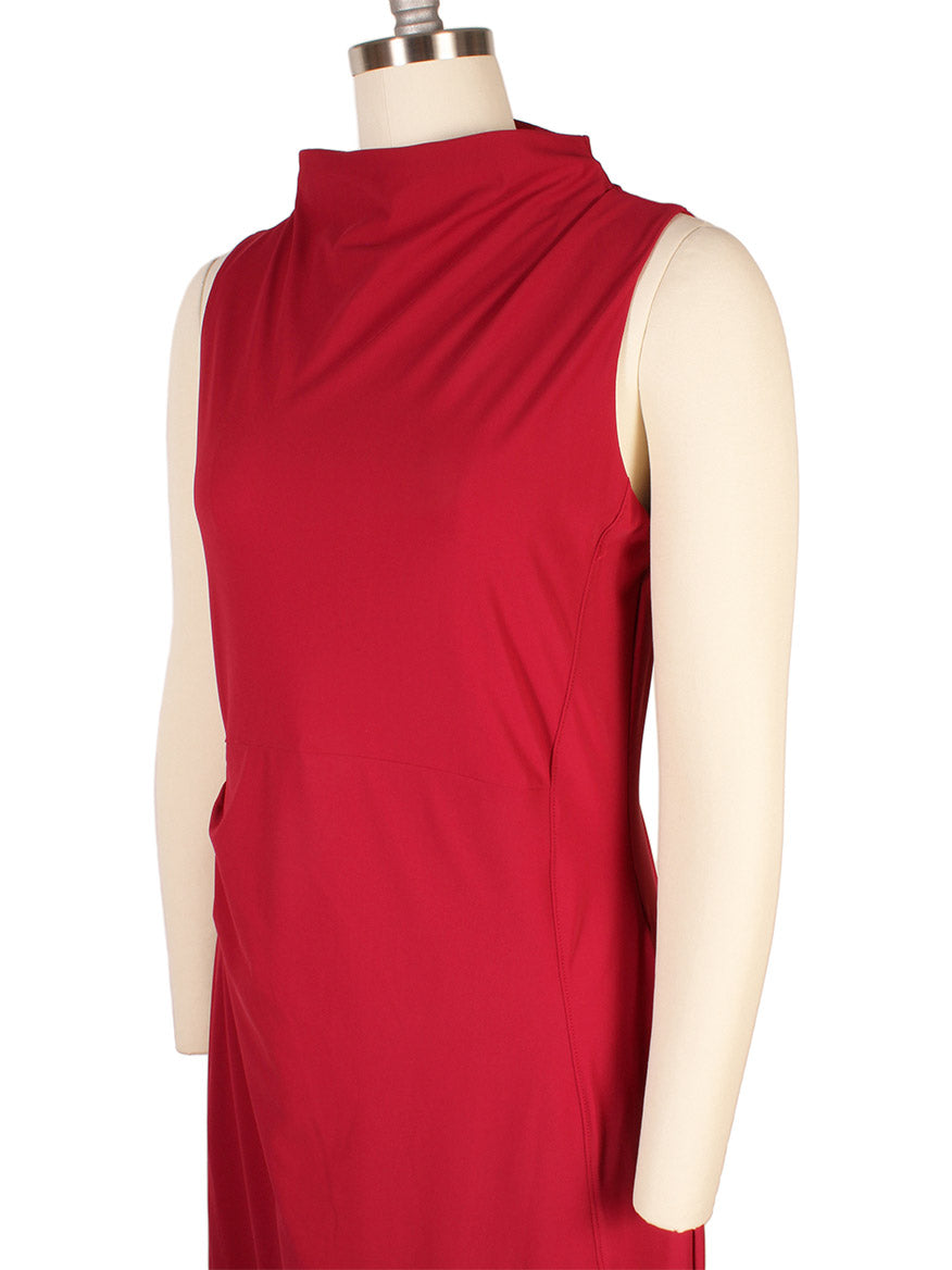 Porto Nina Dress in Garnet displayed on a mannequin, featuring a sleeveless design, high neckline, and fitted silhouette.