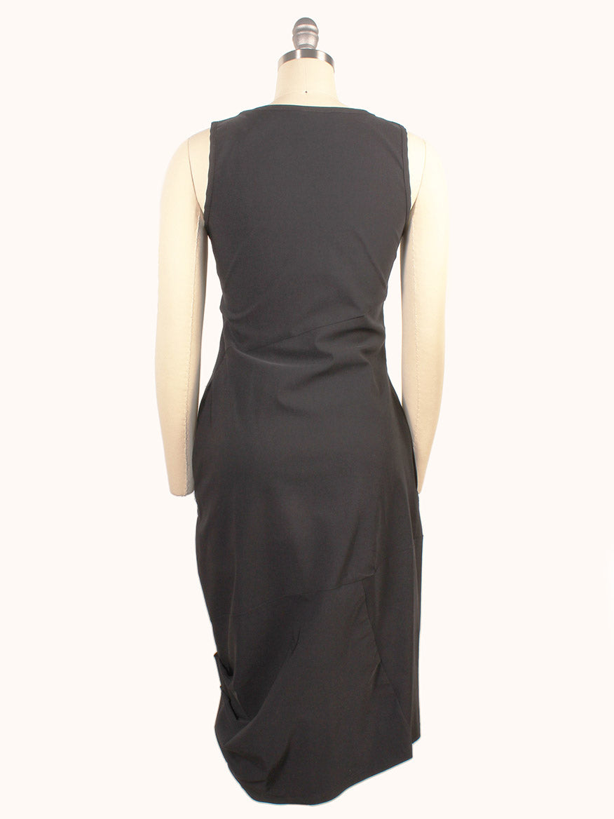 The Porto Nomi Sleeveless Dress in Black, made from stretch fabric, is displayed on a mannequin and shown from the back against a plain white background.