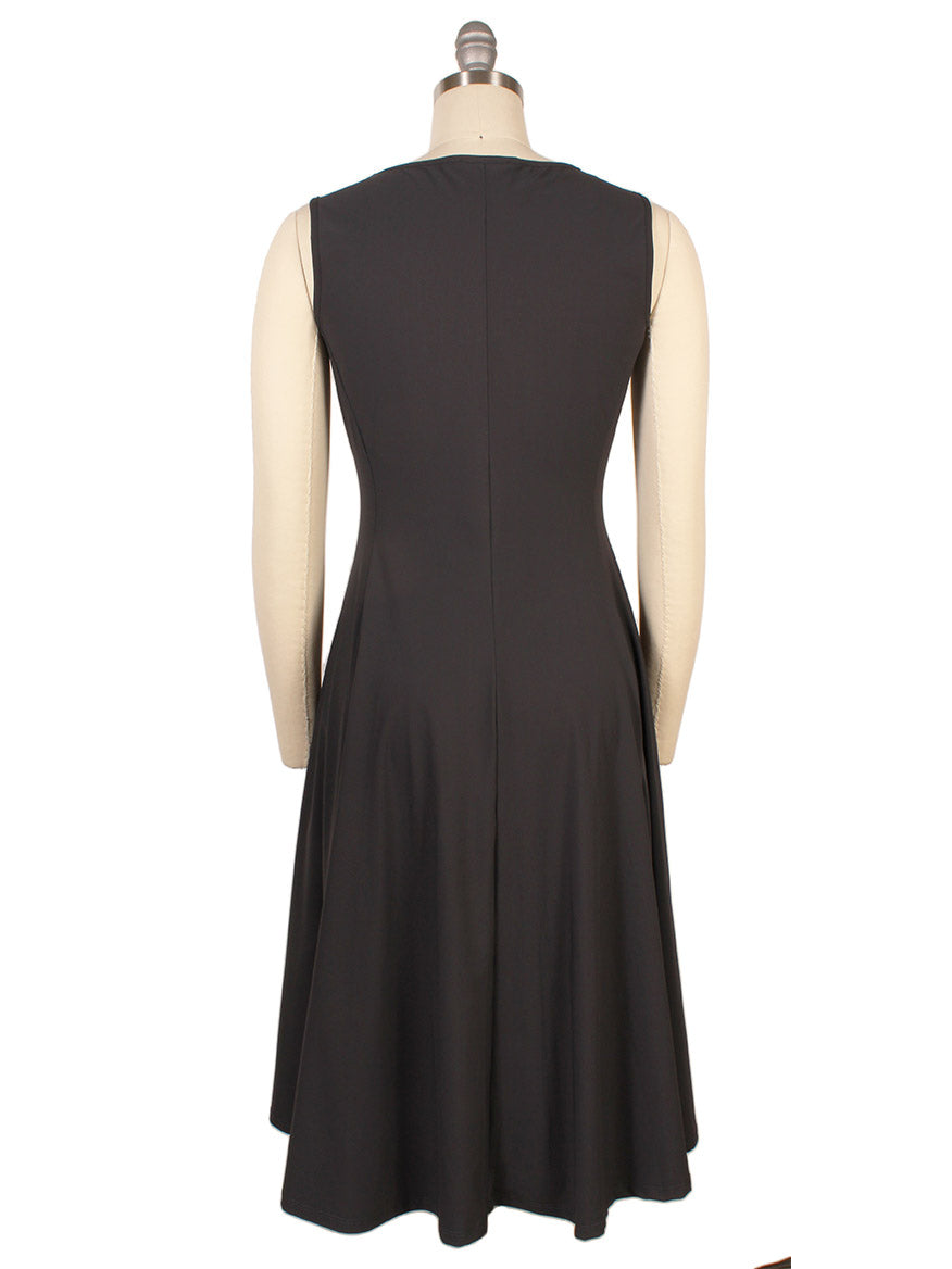 A sleeveless, knee-length Porto Olivia Dress in Smoke with elegant pintuck detail is displayed on a mannequin and shown from the back.