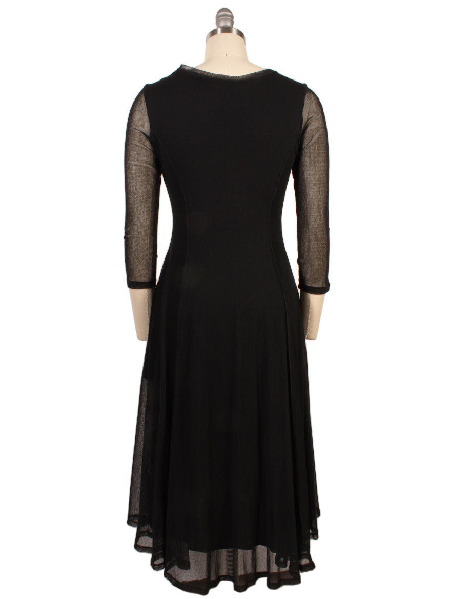 The Porto Pendulum Dress in Black is a knee-length mesh fit-and-flare dress with sheer three-quarter sleeves and a fitted bodice, shown from the back on a dress form.