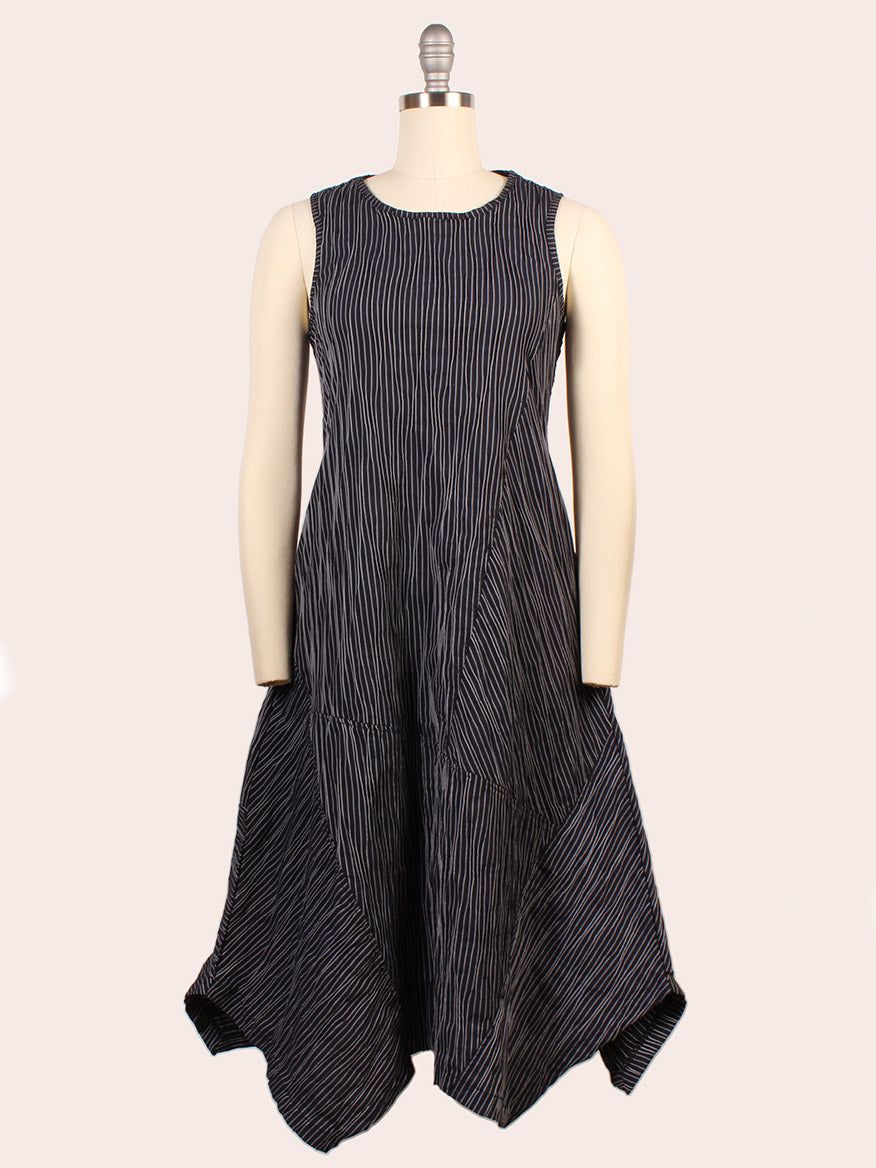 Porto Trophy Nagoya Stripe Sleeveless Dress in Navy, shown on a mannequin with an A-line silhouette, asymmetrical hem, and two large front pockets. Crafted from Nagoya stripe fabric and made in Italy for timeless elegance.