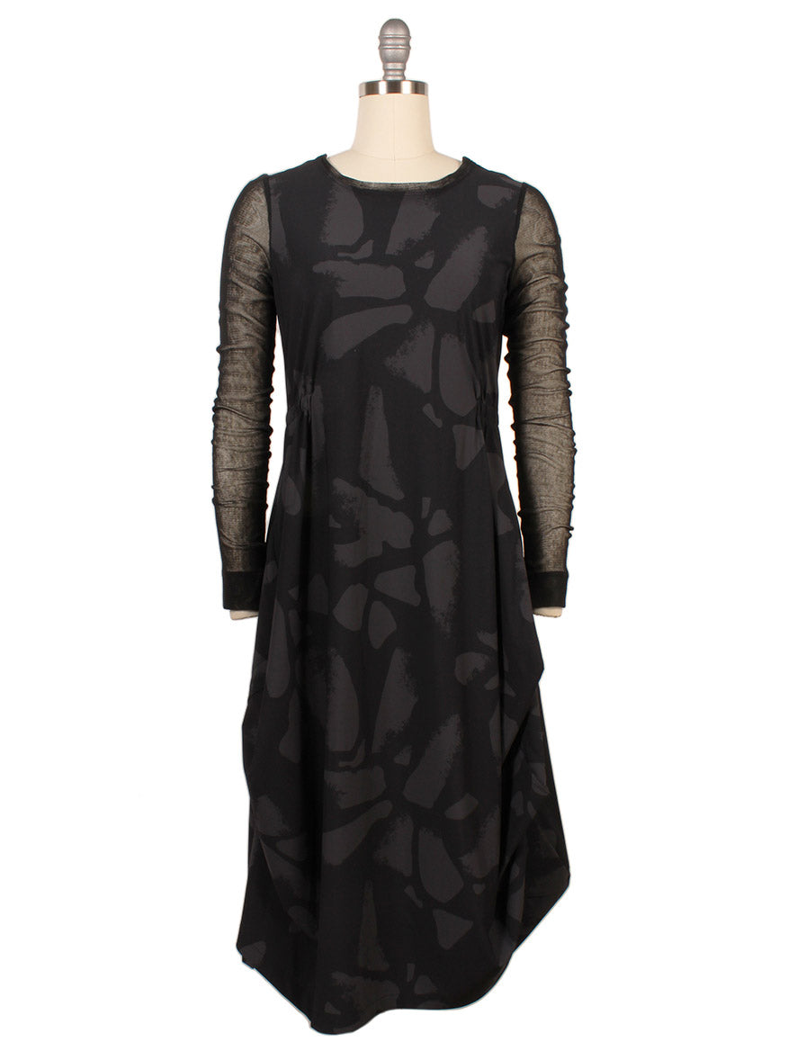The Porto Venetian Dress in Smoke Palermo, made in Italy, features black mesh long sleeves and an abstract dark pattern, elegantly displayed on a mannequin.