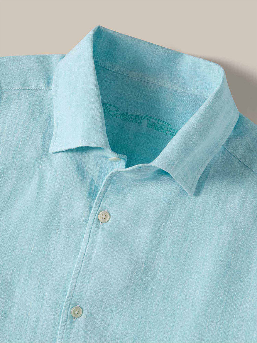 The Robert Talbott Morgan Linen Shirt in Aqua, featuring a California One-Piece Collar, is shown neatly folded on a beige background.